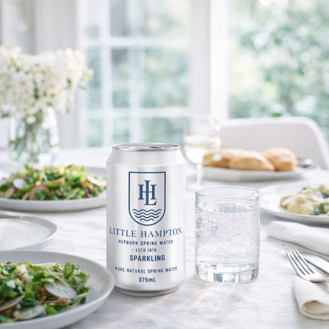 Little Hampton sparkling spring water 375mL cans served at dinner party table