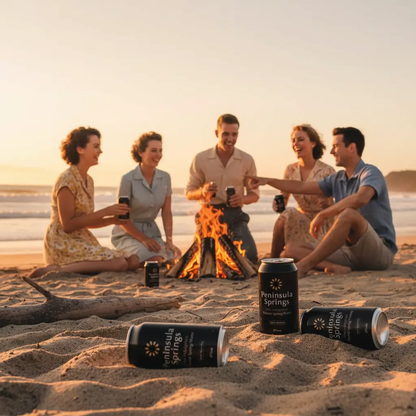 Peninsula Springs Sparkling Water 375ml cans at vintage beach bonfire gathering